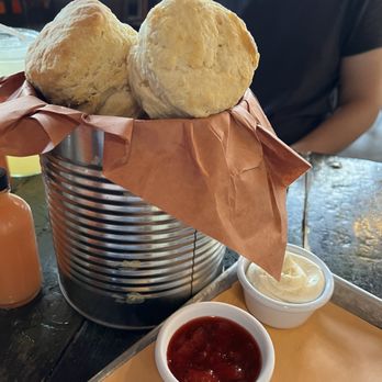 Sweet Cheeks Q - The shining star on the menu - homemade biscuits with honey butter and strawberry jam. - Southern Near Me - Boston, Massachusetts