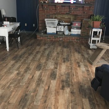 Maxamus Projects - a living room with wood floors and a brick fireplace - Flooring Near Me - Ephrata, Pennsylvania Maxamus Projects - a living room with wood floors and a brick fireplace - Flooring Near Me - Ephrata, Pennsylvania