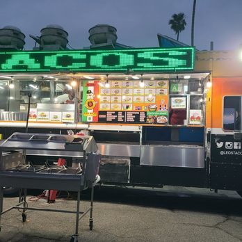Leos Tacos Truck - Taco Truck & Condiments Bar infront of it 06-08-2024 - Tacos Near Me - Wilmington, California Leos Tacos Truck - Taco Truck & Condiments Bar infront of it 06-08-2024 - Tacos Near Me - Wilmington, California
