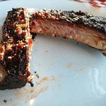 Hog Shack Cook House - Baby-back ribs close-up. - Barbeque Near Me - Richmond, British Columbia Hog Shack Cook House - Baby-back ribs close-up. - Barbeque Near Me - Richmond, British Columbia