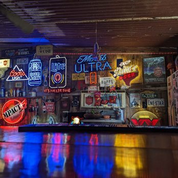 Iron Eagle Beer Garden - a man sitting at a bar - Bars Near Me - Brenham, Texas