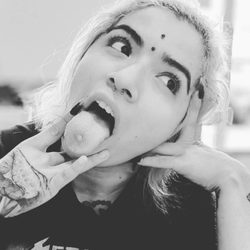 Dubois Piercing - Happy client with her new 
Vertical bridge piercing!