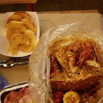 theBoil - Dungeness crabs, kielbasa and garlic bread - Cajun/Creole Near Me - New York, New York theBoil - Dungeness crabs, kielbasa and garlic bread - Cajun/Creole Near Me - New York, New York
