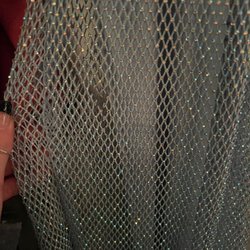 Olio Alterations - Holes in the netting overlay.