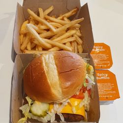 McDonald's - Deluxe spicy chicken sandwich (added pickles and mustard) with fries and buffalo sauce on the side.
