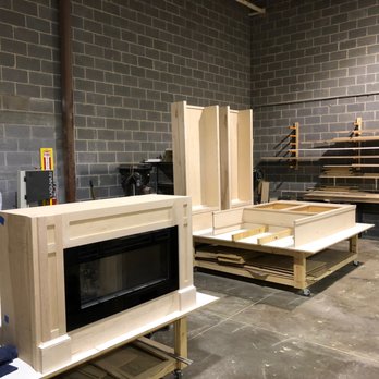 Frazier Custom Cabinetry - Rob sent this picture of the built-in pieces after he made them, before painting. Notice, we sent him the fireplace insert for a custom fit. - Cabinetry Near Me - Manassas Park, Virginia