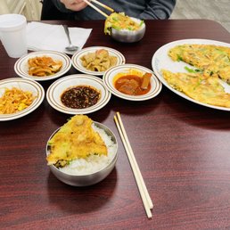 Seafood pancake with various complimentary banchan Seafood pancake with various complimentary banchan