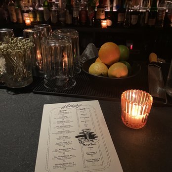 Lullaby - a menu and a lit candle at a bar - Bars Near Me - New York, New York Lullaby - a menu and a lit candle at a bar - Bars Near Me - New York, New York