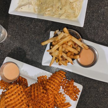Hug Hes - a plate of waffle fries and a plate of french fries - New American Near Me - Centerville, Utah Hug Hes - a plate of waffle fries and a plate of french fries - New American Near Me - Centerville, Utah
