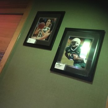 Applebee's Grill + Bar - two framed photos of a football player - American Near Me - Burlington, Iowa Applebee's Grill + Bar - two framed photos of a football player - American Near Me - Burlington, Iowa