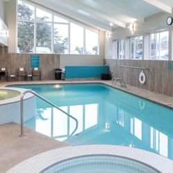 Elements by the Sea - Enjoy access to two Jacuzzis, a pool, and a sauna in a separate building--perfect for unwinding before and after your spa getaway.