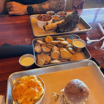 Ruby Red's BBQ - 1/2 plate of ribs with chili  Fried pickle chips  Mac-n-Cheese and a Sweet Pig slider - Barbeque Near Me - La Habra, California