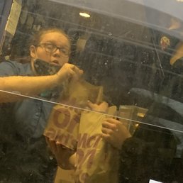 a man holding a bag of food