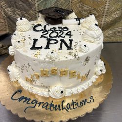Diane’s Patisserie - Graduation cake in vanilla pound cake. Edible cap and scroll.