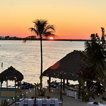 Gus' Grille - Reefhouse Resort & Marina - Someone's wedding under a perfect sunset from Gus' balcony!! - Seafood Near Me - Key Largo, Florida