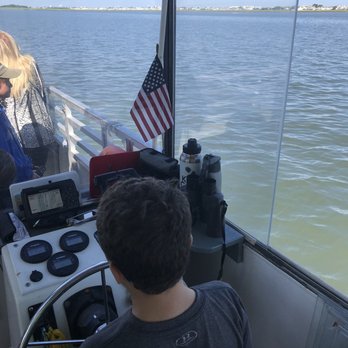Skimmer Salt Marsh Safari - Kid driving the boat - Boat Charters Near Me - Cape May, New Jersey