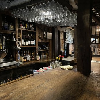 Spring House Tavern - a bar with wine glasses hanging from the ceiling - American Near Me - Gettysburg, Pennsylvania