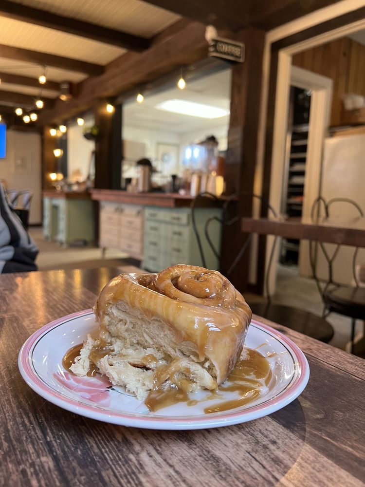 Ooey Gooey Cinnamon Rolls And Cafe Logo