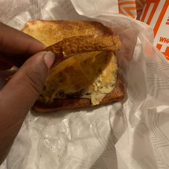 Whataburger - a hand holding a half eaten sandwich - Burgers Near Me - Dallas, Texas Whataburger - a hand holding a half eaten sandwich - Burgers Near Me - Dallas, Texas
