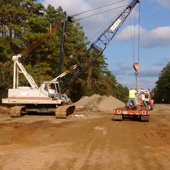 NE-Texas Construction - a crane lifting a truck - General Contractors Near Me - New Boston, Texas