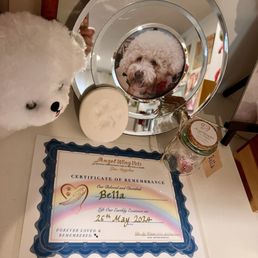 Clay paw print, fur clipping in a pretty jar, & certificate of remembrance were included with her service Clay paw print, fur clipping in a pretty jar, & certificate of remembrance were included with her service