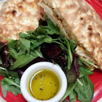 Numero 28 - Pollo panini with mista verde and oil dressing on the side. - Italian Near Me - Austin, Texas Numero 28 - Pollo panini with mista verde and oil dressing on the side. - Italian Near Me - Austin, Texas