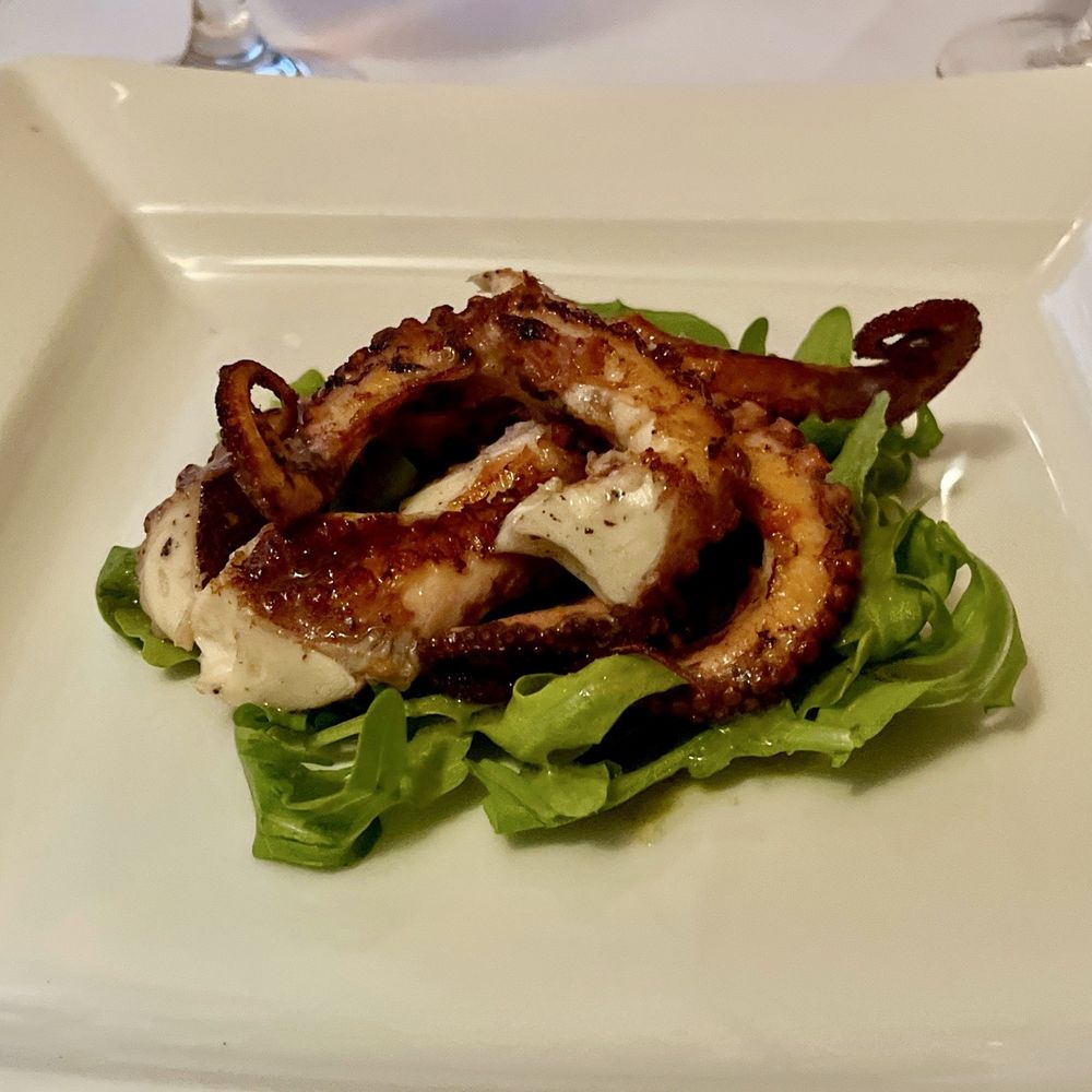 Da Raffaele - Grilled octopus with lemon over arugula - Italian Near Me - New York, New York Da Raffaele - Grilled octopus with lemon over arugula - Italian Near Me - New York, New York