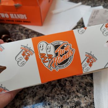 Two Hands Corn Dogs - two hands holding a box of corn dogs - Fast Food Near Me - Downey, California