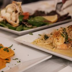 Salvatore's of Elmont - Ravioli (left0), Stuffed shrimp (right), Lobster and Skirt Steak (rear)