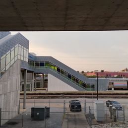 View of escalators and covered walkway from station to train. If you requested assistance or are disabled, porters will provide a ride. View of escalators and covered walkway from station to train. If you requested assistance or are disabled, porters will provide a ride.