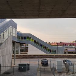 Amtrak - View of escalators and covered walkway from station to train.   If you requested assistance or are disabled, porters will provide a ride.
