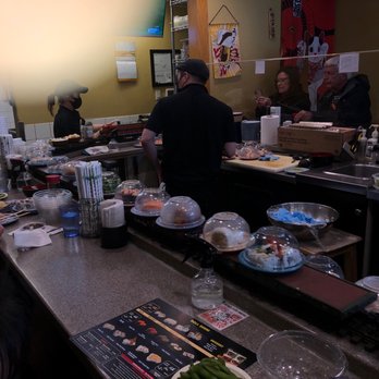 Sushi House - a group of people preparing food - Sushi Bars Near Me - Banff, Alberta