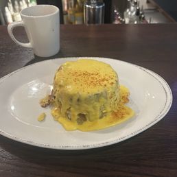 Mile high tower - chicken , potatoes, mushrooms, cheese , hollandaise Mile high tower - chicken , potatoes, mushrooms, cheese , hollandaise