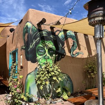 The Burger Stand - a woman painted on the side of a building - Burgers Near Me - Taos, New Mexico