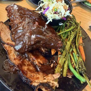 Babe's Smokehouse & Tavern - Good size half rack of baby back ribs but just way too much bbq sauce. - Barbeque Near Me - Indio, California