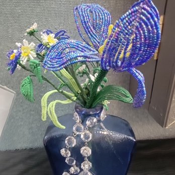 Beaded Iris - Beaded flower - A beaded flower arrangement featuring a butterfly and small flowers in a dark blue vase, decorated with hanging crystal beads. - Arts & Crafts Near Me - Albuquerque, New Mexico