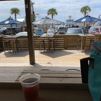 The Harbor Tavern - Patio area in front of the bar, facing the dock - Bars Near Me - Destin, Florida The Harbor Tavern - Patio area in front of the bar, facing the dock - Bars Near Me - Destin, Florida