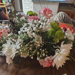 Flowers By Judy - Again, notice the use of filler and the absence of any rose on the other side?