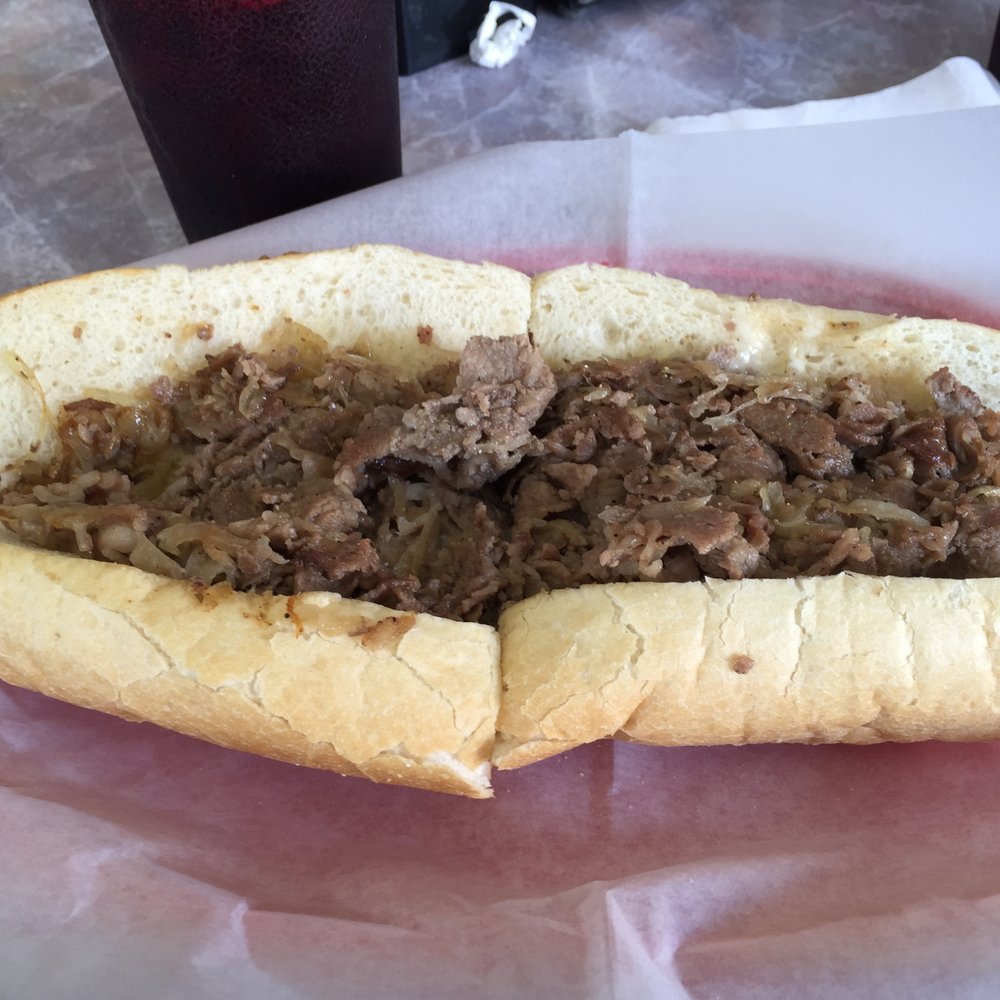 Philly Junction - Cheesesteak with grilled onion on Amoroso roll - Sandwiches Near Me - Fort Myers, Florida Philly Junction - Cheesesteak with grilled onion on Amoroso roll - Sandwiches Near Me - Fort Myers, Florida