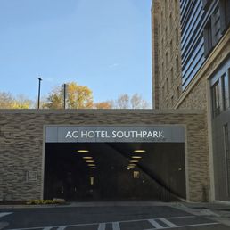 Parking garage and entrance to hotel on right