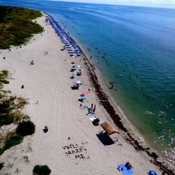 Cape Florida Lighthouse - Miles and miles of water, sand and umbrellas.  Can you spot the marriage proposal in the sand, made out of seaweed? - Landmarks & Historical Buildings Near Me - Key Biscayne, Florida