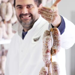 Creminelli Fine Meats - Cristiano Creminelli with some of his hand-tied artisan goods.