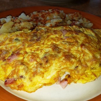 Country Charm - an omelet and potatoes on a plate - Breakfast & Brunch Near Me - New Lenox, Illinois Country Charm - an omelet and potatoes on a plate - Breakfast & Brunch Near Me - New Lenox, Illinois