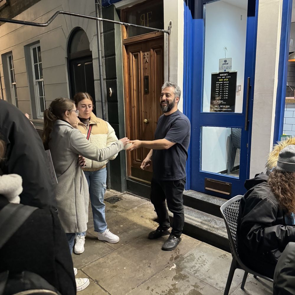 Hobson's Fish & Chips - Owner outside passing out chips to those waiting - British Near Me - London, XGL