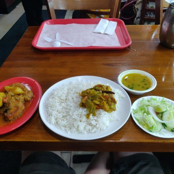 Merit Kabab Palace - Fish curry lunch special. Fish curry on left, rice and mixed vegetables, lentil soup, and salad. $9. - Indian Near Me - New York, New York Merit Kabab Palace - Fish curry lunch special. Fish curry on left, rice and mixed vegetables, lentil soup, and salad. $9. - Indian Near Me - New York, New York