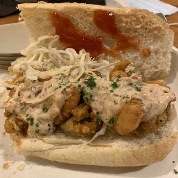 Trenasse - Shoyster Po Boy on The Queen of New Orleans French Bread. That's shrimp and oysters fried to perfection and intermingled - Wine Bars Near Me - New Orleans, Louisiana Trenasse - Shoyster Po Boy on The Queen of New Orleans French Bread. That's shrimp and oysters fried to perfection and intermingled - Wine Bars Near Me - New Orleans, Louisiana