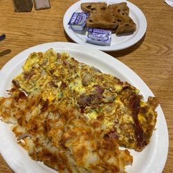 Main St Family Restaurant - House omelette (added bacon and sausage). American fries and Raisin toast