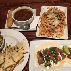5th Street Bar & Woodfire Grill - Top left: vegetable lentil soup  Top right: parmesan fries Bottom left: spinach and artichoke dip Bottom right: steak tacos