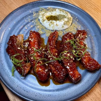 Morcilla - costillas de la matanza - baby back pork ribs, harissa honey, za'atar, labneh - Spanish Near Me - Pittsburgh, Pennsylvania Morcilla - costillas de la matanza - baby back pork ribs, harissa honey, za'atar, labneh - Spanish Near Me - Pittsburgh, Pennsylvania