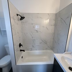Ram Remodels - New bathtub, tile and fixtures